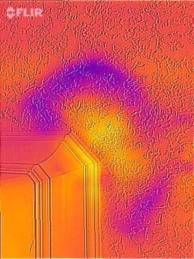 Thermal image of water damage on the ceiling in the bathroom.